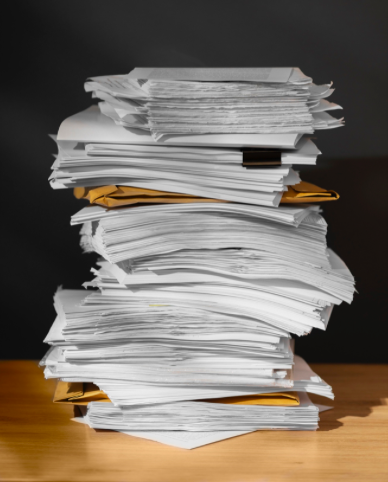 Tall stack of papers and files