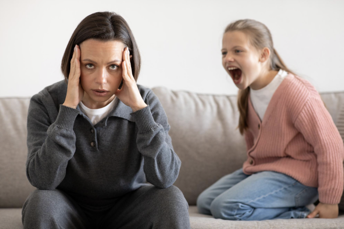child yelling at stressed adult