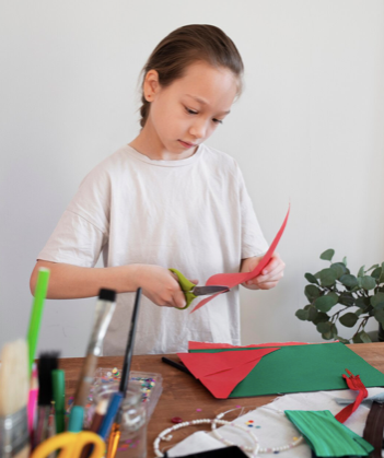 girl cutting coloured card