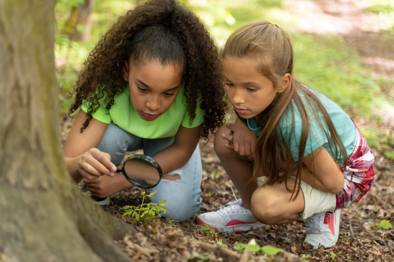 two girls gardening