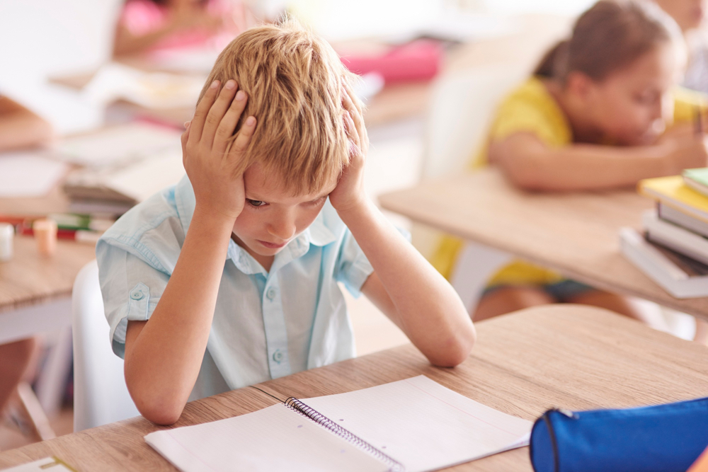 Stressed boy in school