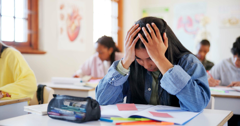Stressed teen at her desk