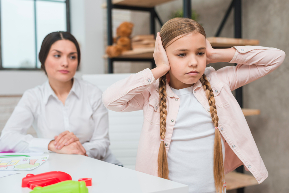 Child ignoring adult