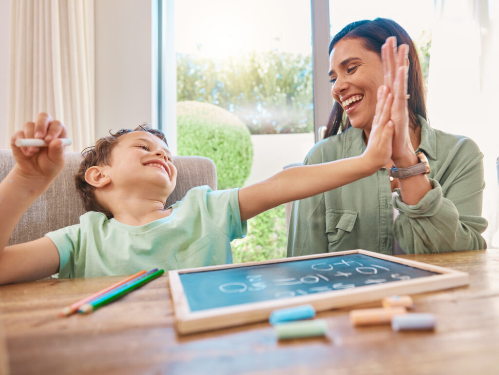 High five, mother and child education, learning and teaching math, numbers and home development goals or support. Yes, success and celebration hands of family, mom and happy kid with chalkboard.
